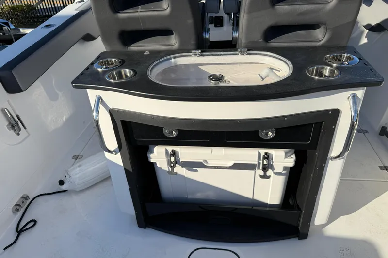 Slide: The Image of 2026 Sea Pro 292 DLX boat interior with seating and storage compartments. - 11