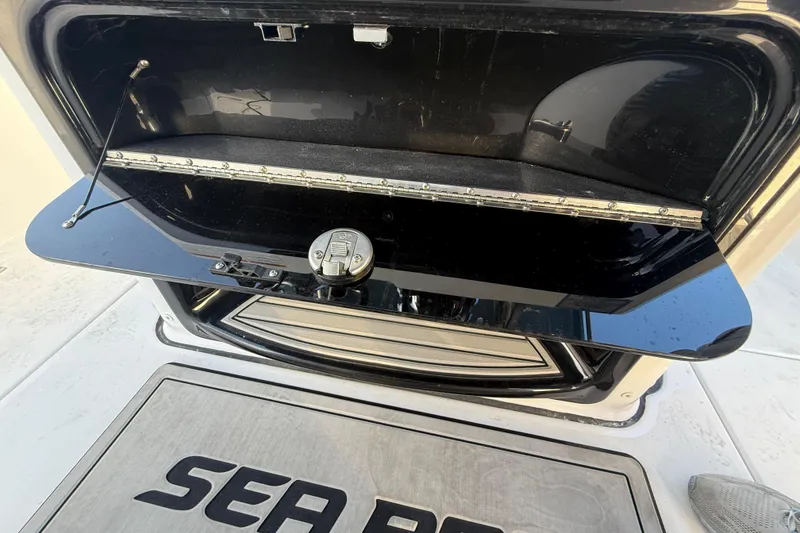 Slide: The Image of Open storage compartment on 2026 Sea Pro 292 DLX boat, showcasing sleek design and functionality. - 26