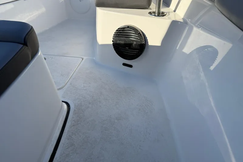 Slide: The Image of Interior of 2026 Sea Pro 292 DLX boat, featuring seating and speaker. - 32