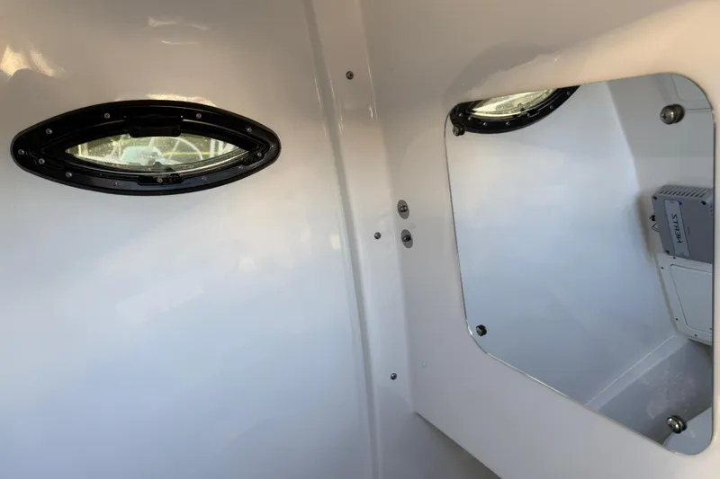Slide: The Image of Interior of 2026 Sea Pro 292 DLX boat with porthole and mirror. - 36