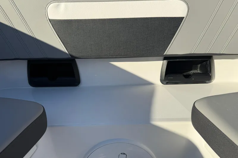 Slide: The Image of 2026 Sea Pro 292 DLX boat interior seating with cup holders. - 37