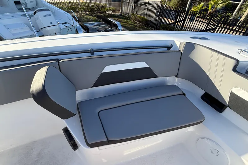 Slide: The Image of 2026 Sea Pro 292 DLX boat interior with gray seating and modern design. - 38
