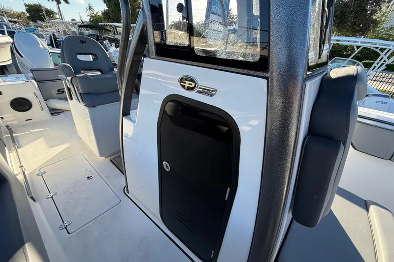 Slide: The Image of 2026 Sea Pro 292 DLX boat interior with seating and console details. - 46