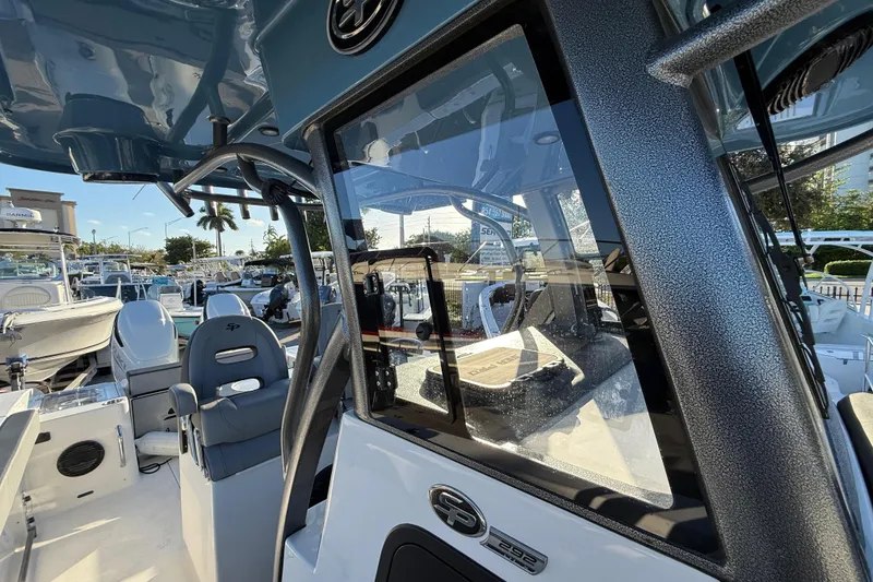 Slide: The Image of 2026 Sea Pro 292 DLX boat interior with modern seating and dashboard. - 48