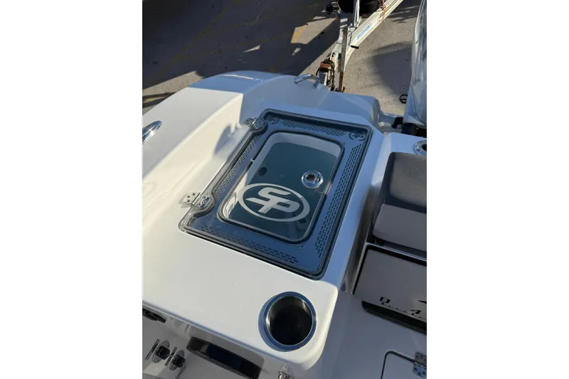 Slide: The Image of 2026 Sea Pro 292 DLX boat deck with logo and cup holder. - 6