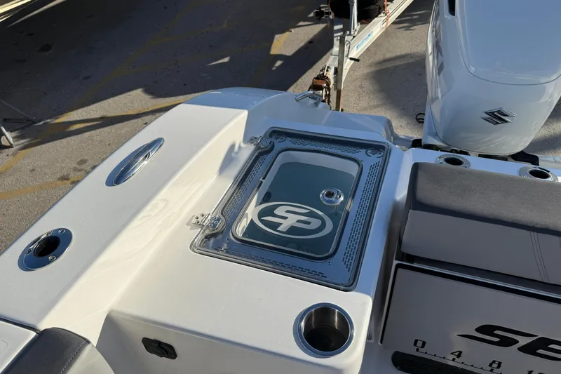 Slide: The Image of 2026 Sea Pro 292 DLX boat deck with logo and seating area. - 7
