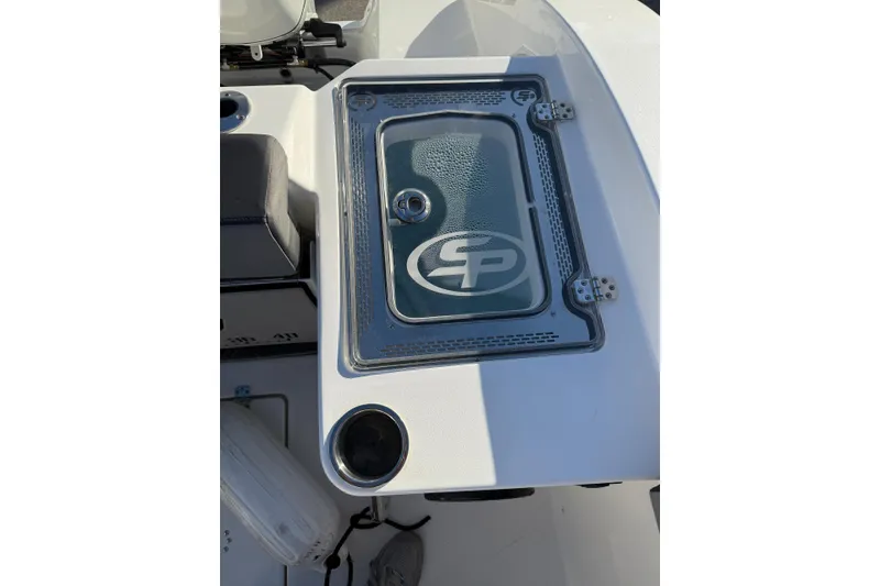 Slide: The Image of 2026 Sea Pro 292 DLX boat console with branded glass cover and cup holder. - 8