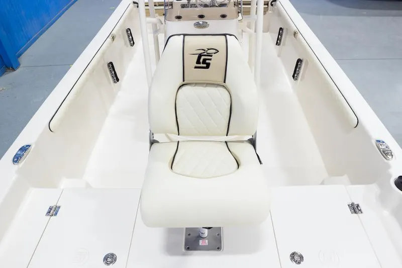 Slide: The Image of Manufacturer Provided Image: 2026 Carolina Skiff 21 LS boat interior with white seating and LS logo. - 4