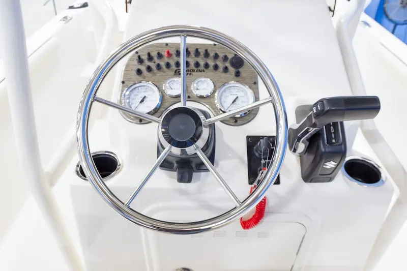 Slide: The Image of Manufacturer Provided Image: Steering console of 2026 Carolina Skiff 21 LS boat with gauges and controls. - 6