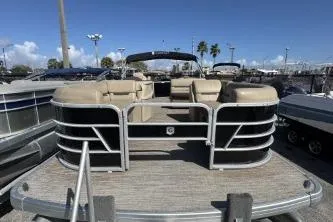 Slide: The Image of 2022 Godfrey Sweetwater 2286 C pontoon boat with beige seating and sleek design. - 4