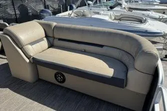 Slide: The Image of 2022 Godfrey Sweetwater 2286 C boat seating area with beige upholstery. - 6
