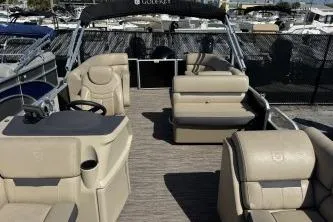 Slide: The Image of 2022 Godfrey Sweetwater 2286 C pontoon boat with beige seating and spacious deck. - 7