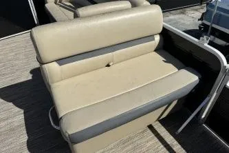 Slide: The Image of 2022 Godfrey Sweetwater 2286 C boat seat, beige upholstery, outdoor setting. - 8