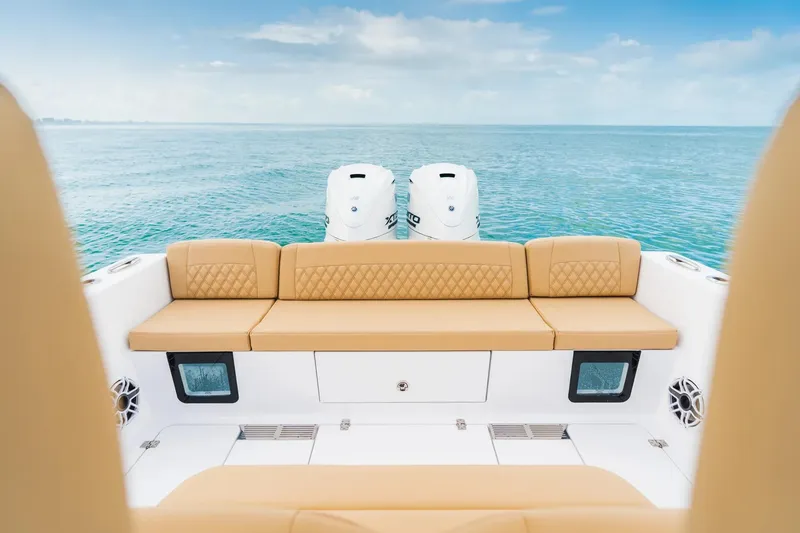 Slide: The Image of Manufacturer Provided Image: 2025 Sportsman Heritage 321 Center Console boat with tan seating, ocean view. - 9