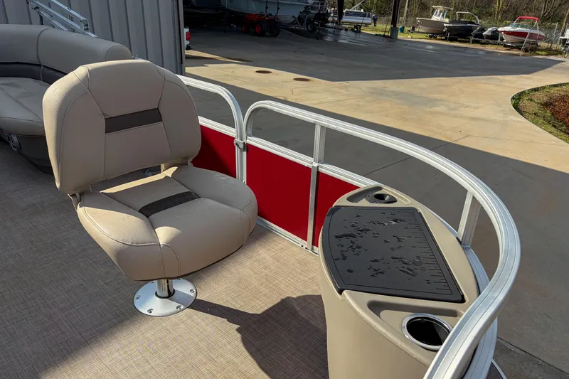 Slide: The Image of 2024 Sun Tracker Bass Buggy 18 DLX pontoon boat with seating and fishing station. - 9