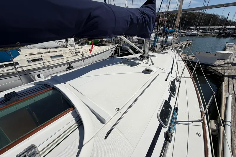 Slide: The Image of Sailboat deck view of 1996 Beneteau First 42s7 docked at marina. - 12