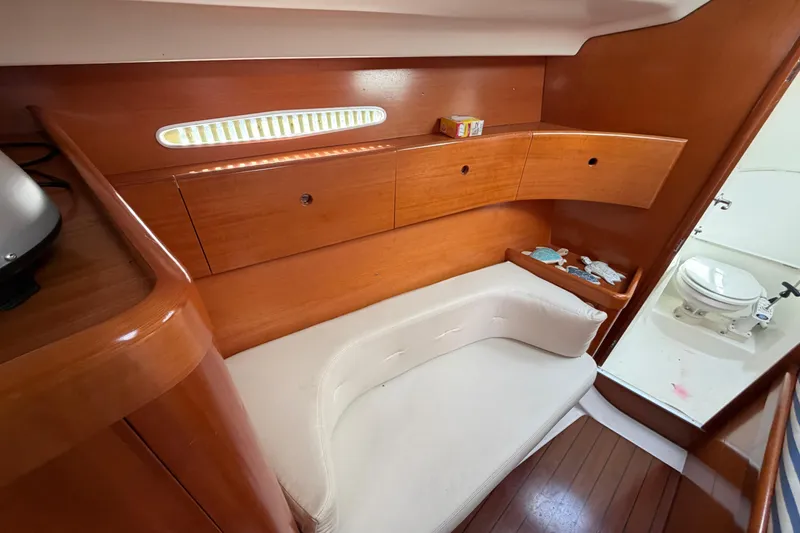 Slide: The Image of Interior of 1996 Beneteau First 42s7 yacht with wooden cabinetry and compact bathroom. - 20