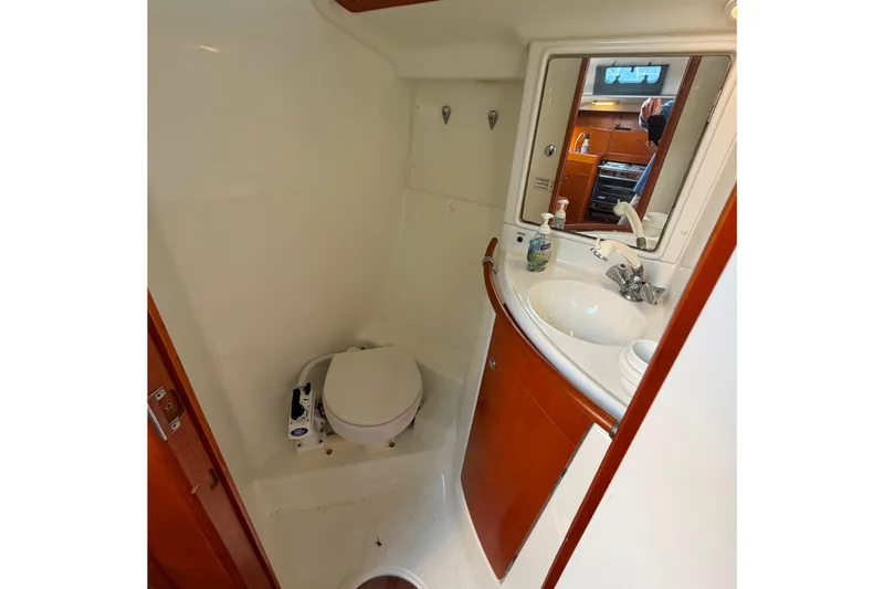 Slide: The Image of Bathroom interior of 1996 Beneteau First 42s7 yacht with sink and toilet. - 24