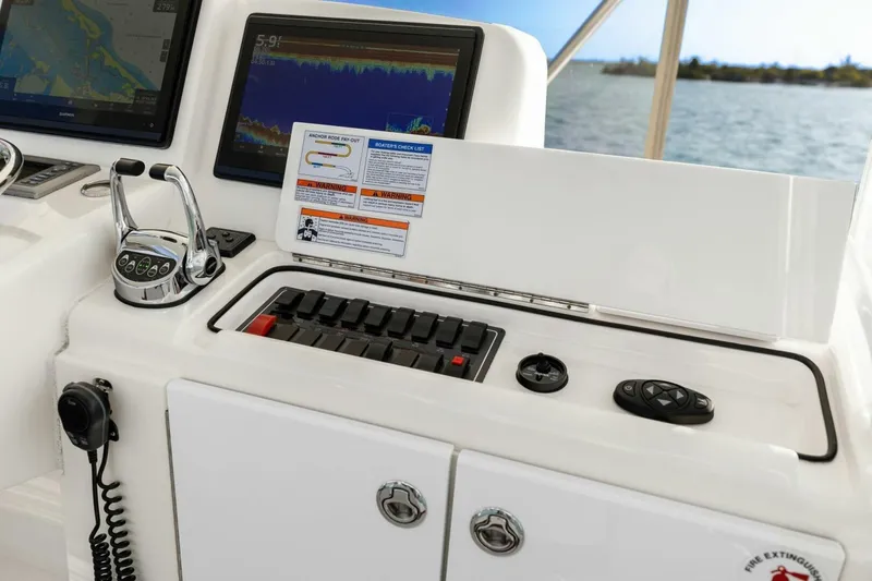 Slide: The Image of Control panel of 2013 Tiara Yachts 3900 Convertible with navigation screens and throttle. - 11