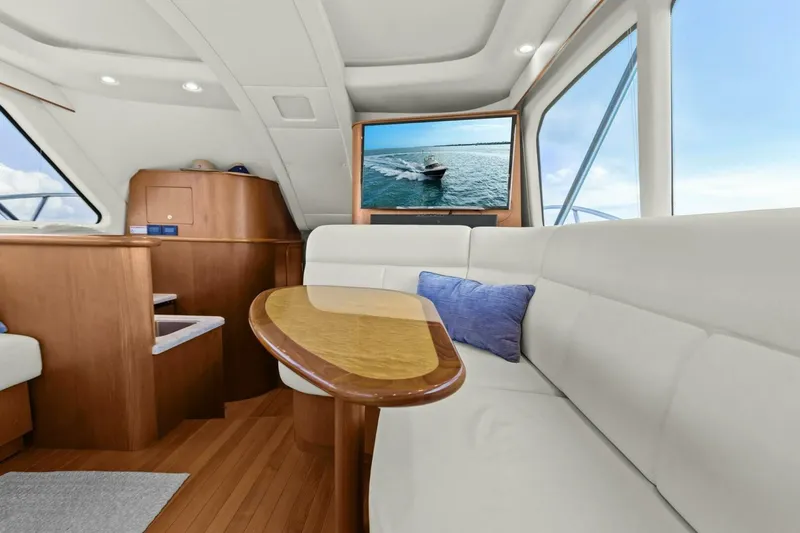 Slide: The Image of Luxurious interior of 2013 Tiara Yachts 3900 Convertible with elegant seating and wooden accents. - 13