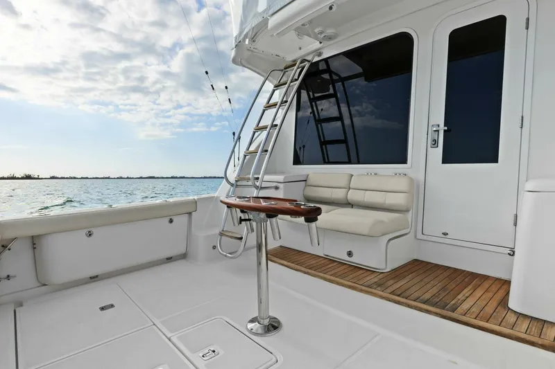 Slide: The Image of 2013 Tiara Yachts 3900 Convertible, featuring spacious deck and seating, ocean view. - 39