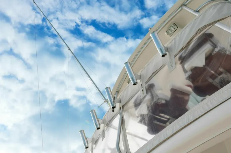 Slide: The Image of 2013 Tiara Yachts 3900 Convertible against a blue sky with clouds. - 40