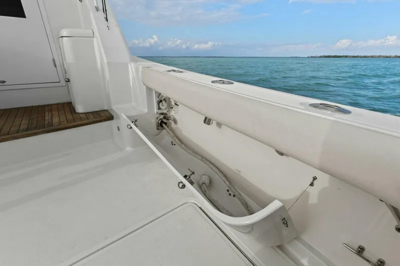Slide: The Image of 2013 Tiara Yachts 3900 Convertible deck with ocean view, featuring clean white surfaces. - 45