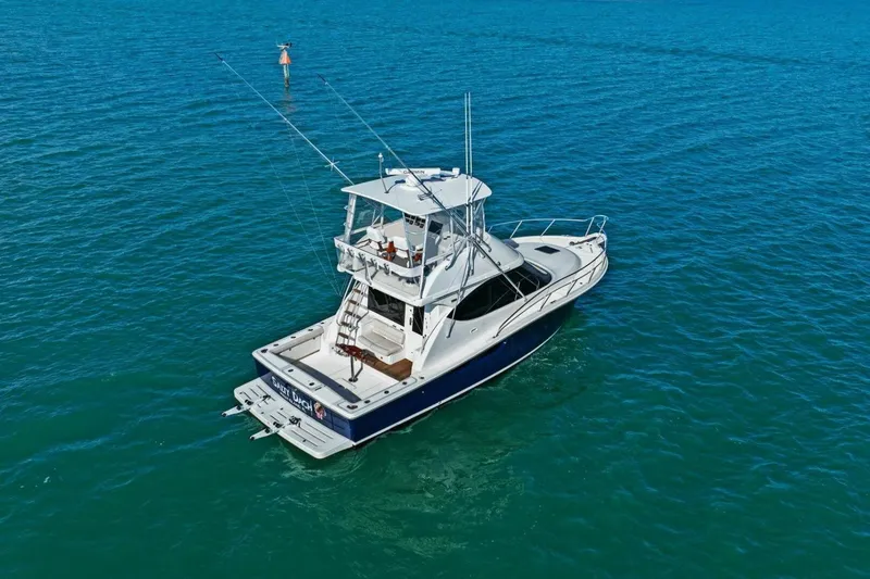 Slide: The Image of 2013 Tiara Yachts 3900 Convertible cruising on open blue waters. - 51