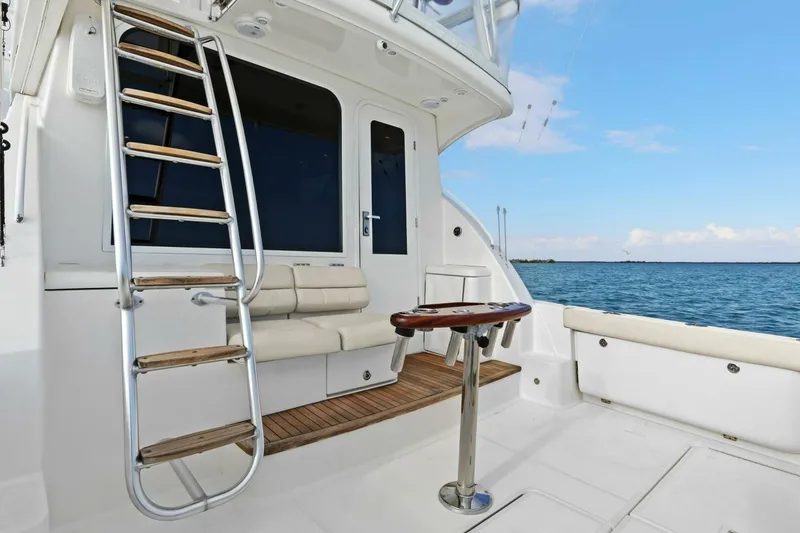 Slide: The Image of 2013 Tiara Yachts 3900 Convertible boat deck with seating and ocean view. - 6