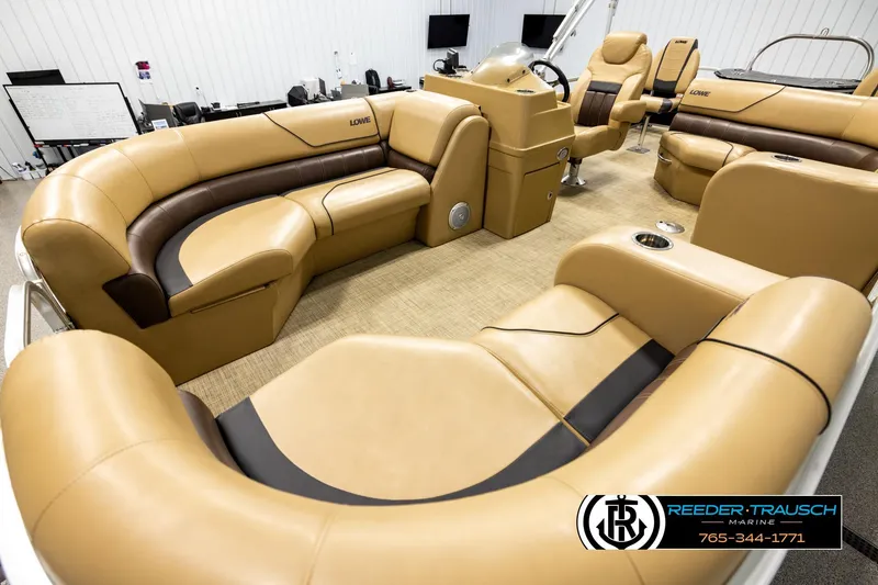 Slide: The Image of 2019 Lowe SF 212 Sport Fish boat interior with tan and brown seating, spacious layout. - 10