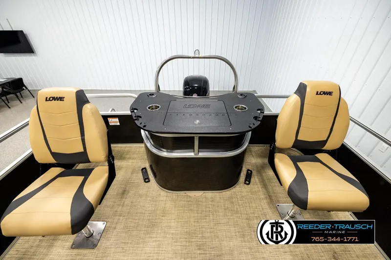 Slide: The Image of 2019 Lowe SF 212 Sport Fish boat interior with two tan seats and a central console. - 15