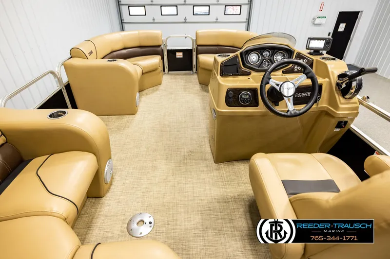 Slide: The Image of 2019 Lowe SF 212 Sport Fish boat interior with tan seating and modern dashboard. - 17