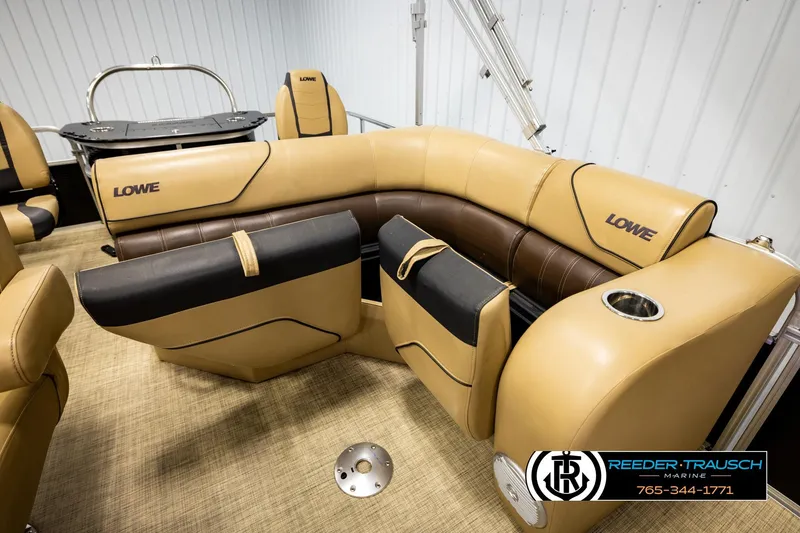 Slide: The Image of 2019 Lowe SF 212 Sport Fish boat interior with tan and brown seating, cup holder, and logo. - 21