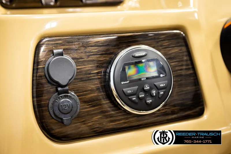 Slide: The Image of Dashboard of 2019 Lowe SF 212 Sport Fish with Jensen audio system and 12V outlet. - 27