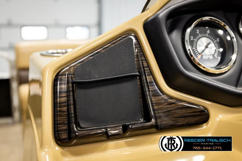 Slide: The Image of Close-up of 2019 Lowe SF 212 Sport Fish dashboard with RPM gauge and wood accents. - 28