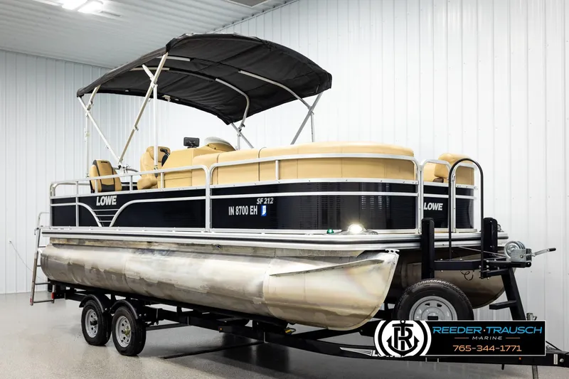 Slide: The Image of 2019 Lowe SF 212 Sport Fish pontoon boat on trailer in indoor showroom. - 3