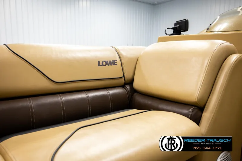 Slide: The Image of 2019 Lowe SF 212 Sport Fish boat interior with tan and brown seating. - 35