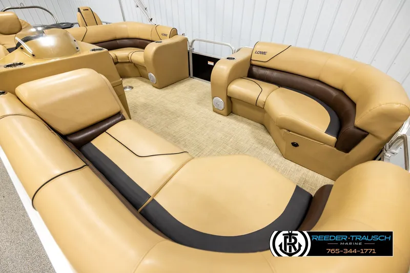 Slide: The Image of Luxurious interior of 2019 Lowe SF 212 Sport Fish pontoon boat with tan seating. - 9