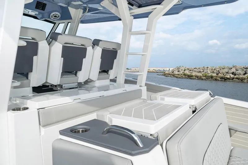 Slide: The Image of 2022 Pursuit S 428 Sport boat docked with four powerful outboard engines. - 15