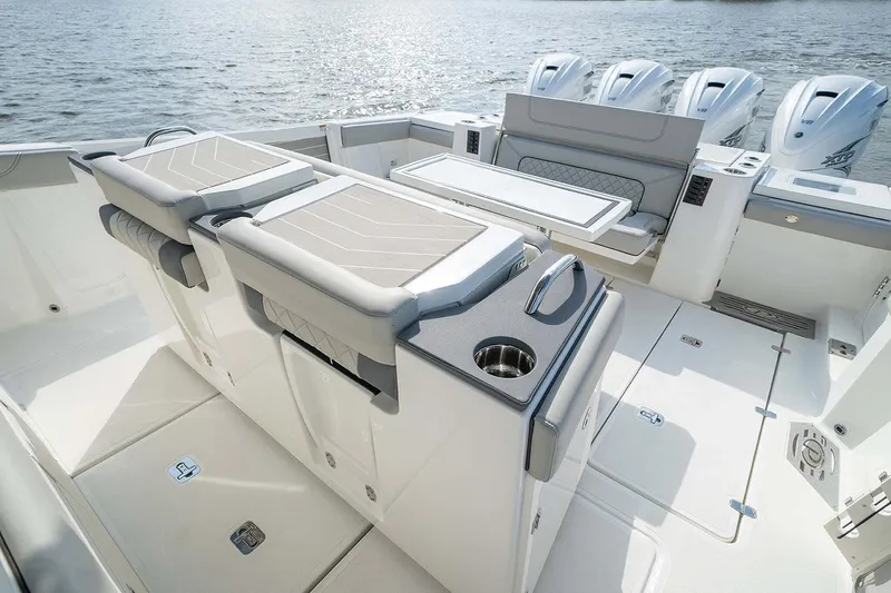 Slide: The Image of 2022 Pursuit S 428 Sport boat interior with covered seats and modern design. - 17