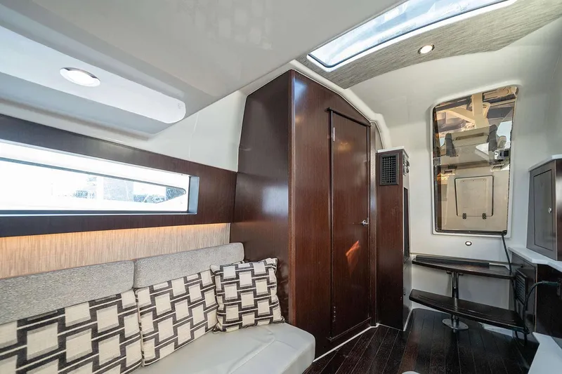 Slide: The Image of 2022 Pursuit S 428 Sport boat interior with covered seats and sleek design. - 18