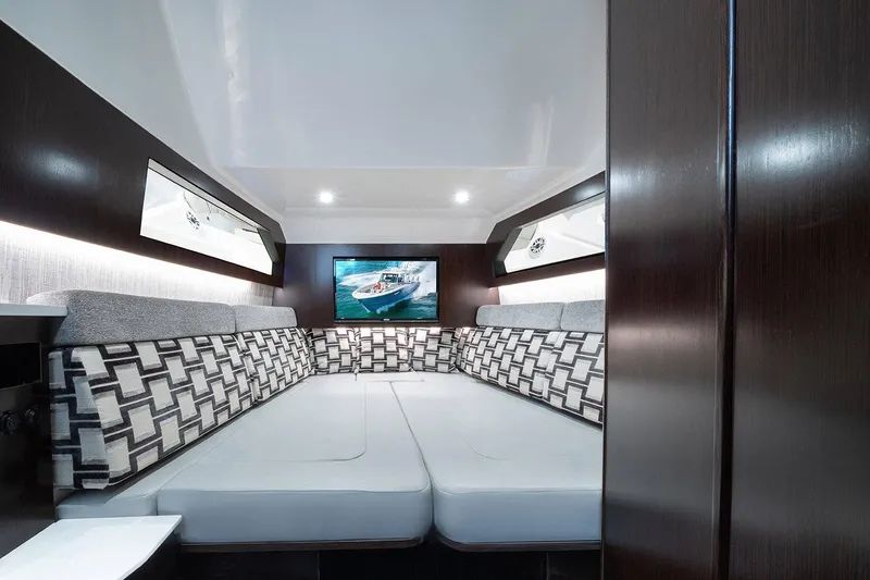 Slide: The Image of 2022 Pursuit S 428 Sport boat interior with quad engines at marina. - 21