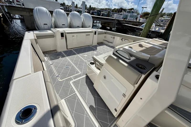 Slide: The Image of 2022 Pursuit S 428 Sport boat interior with spacious deck and seating area. - 23