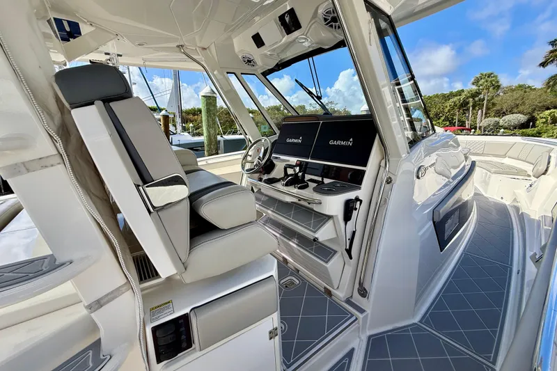 Slide: The Image of 2022 Pursuit S 428 Sport boat interior with modern helm and seating. - 38