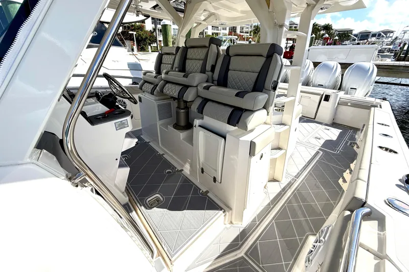 Slide: The Image of 2022 Pursuit S 428 Sport boat interior with luxurious seating and modern design. - 40