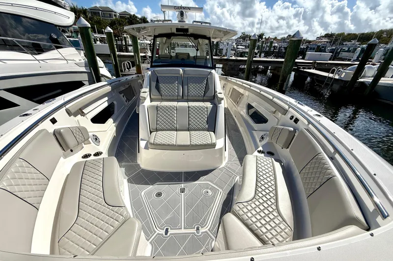 Slide: The Image of 2022 Pursuit S 428 Sport boat interior with luxurious seating and modern design. - 49