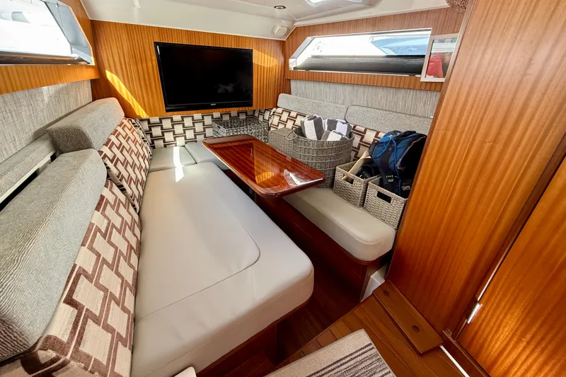Slide: The Image of Luxurious interior of 2022 Pursuit S 428 Sport boat with elegant seating and wooden finishes. - 55