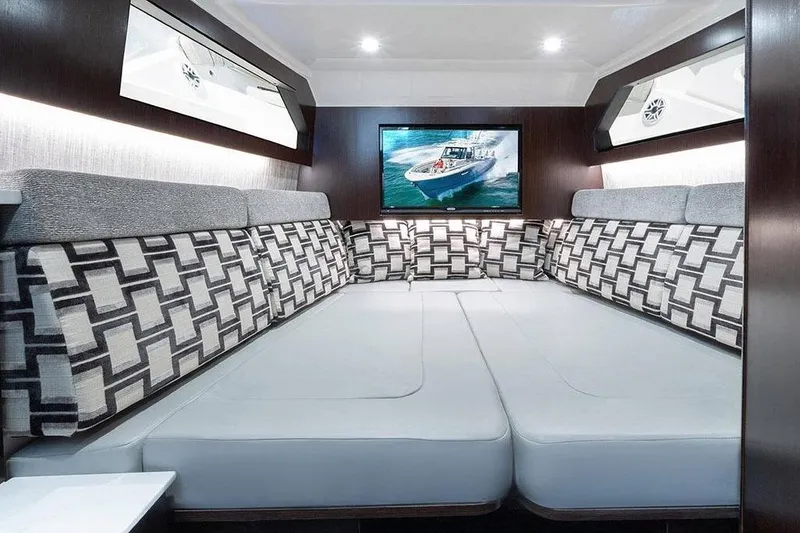 Slide: The Image of Manufacturer Provided Image: Interior cabin of 2022 Pursuit S 428 Sport boat with modern seating and TV. - 57