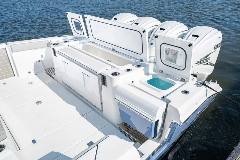 Slide: The Image of 2022 Pursuit S 428 Sport boat cruising on a scenic waterway. - 6