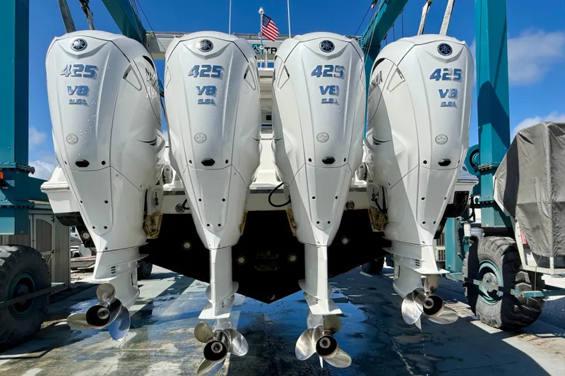 Slide: The Image of Four Yamaha 425 V8 outboard engines on a 2022 Pursuit S 428 Sport boat. - 65